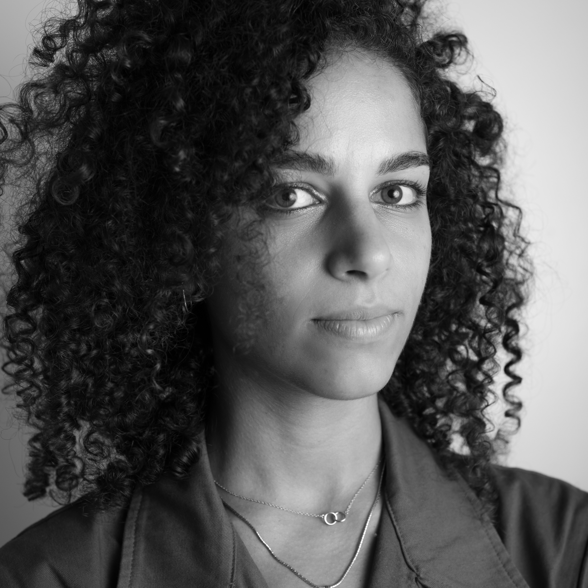 A portrait photo of writer Ashley Hefnawy